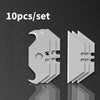 Diez piezas de un juego de cuchillas multiherramienta para bricolaje y manualidades, en color gris.