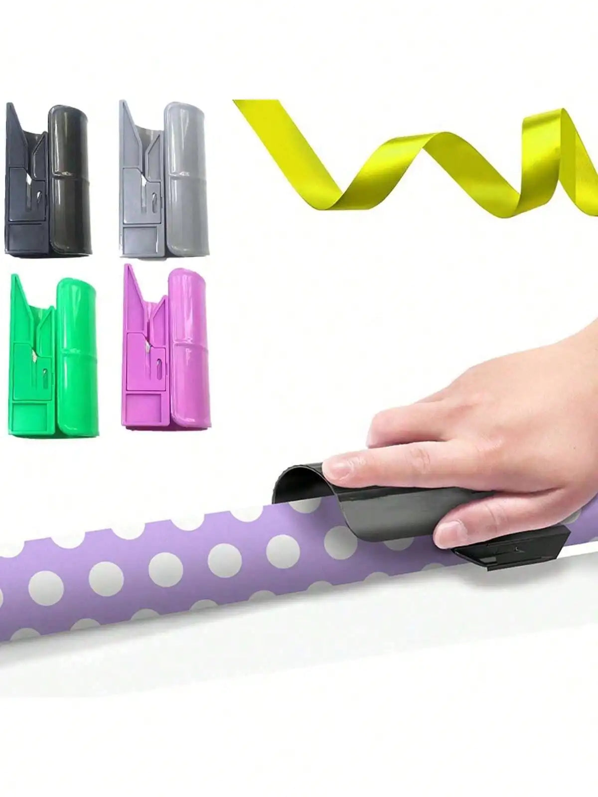 A hand is shown using a portable plastic wrapping paper cutter on purple patterned paper.