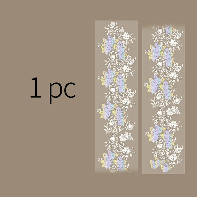 Two vertical strips of decorative silver stamping lace tape featuring floral patterns in purple and white on a beige backgrou