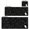 Black abstract desk mat with white contour lines and small white grips