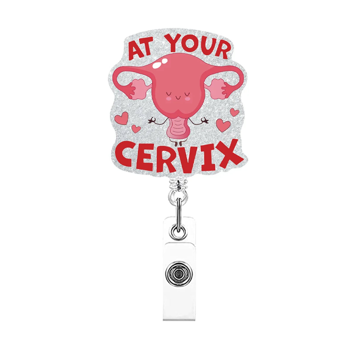 A pink anatomical heart shaped charm with the text At Your Cervix on a silver acrylic necklace.