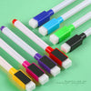 Eight magnetic whiteboard pens in various colors and tips are displayed on a green background.