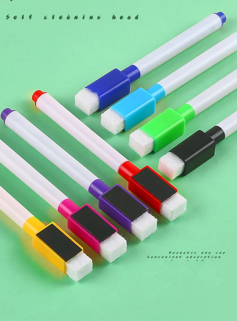 Eight magnetic whiteboard pens in various colors and tips are displayed on a green background.