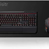 A black mechanical keyboard and an orange gaming mouse are displayed on a dark surface.