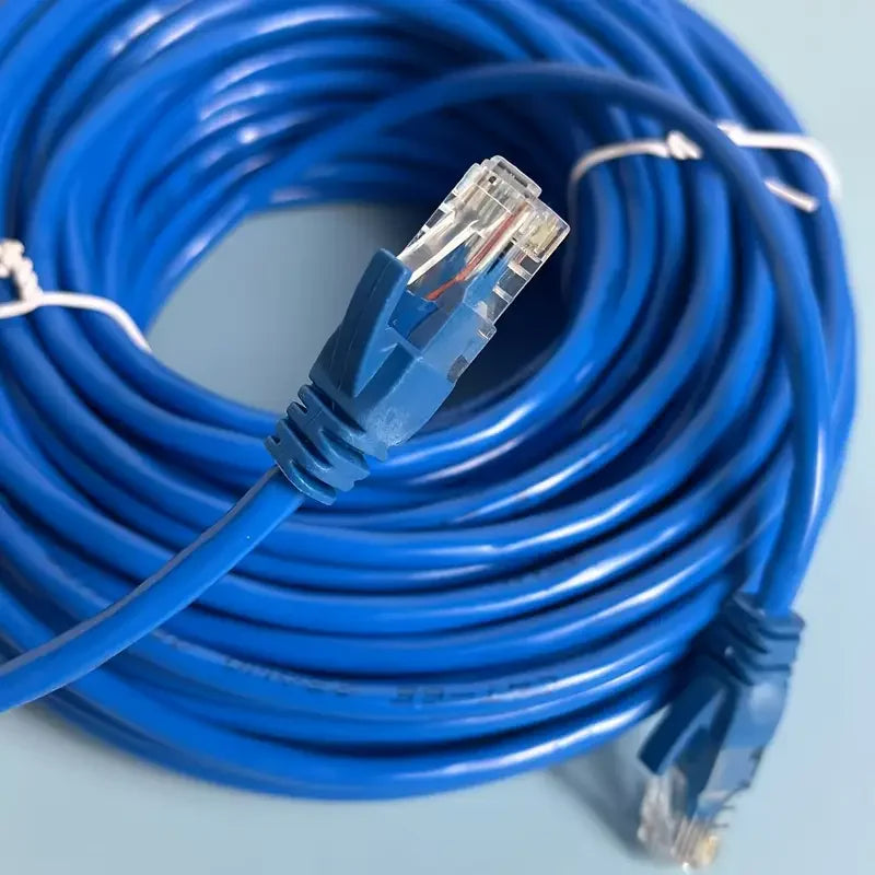 A coiled blue Cat6 Ethernet patch cable with a connector tip visible.