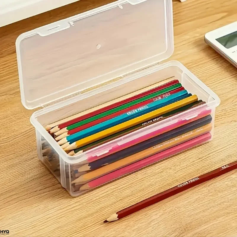 Clear storage box with a lid filled with various colored pencils on a wooden surface.
