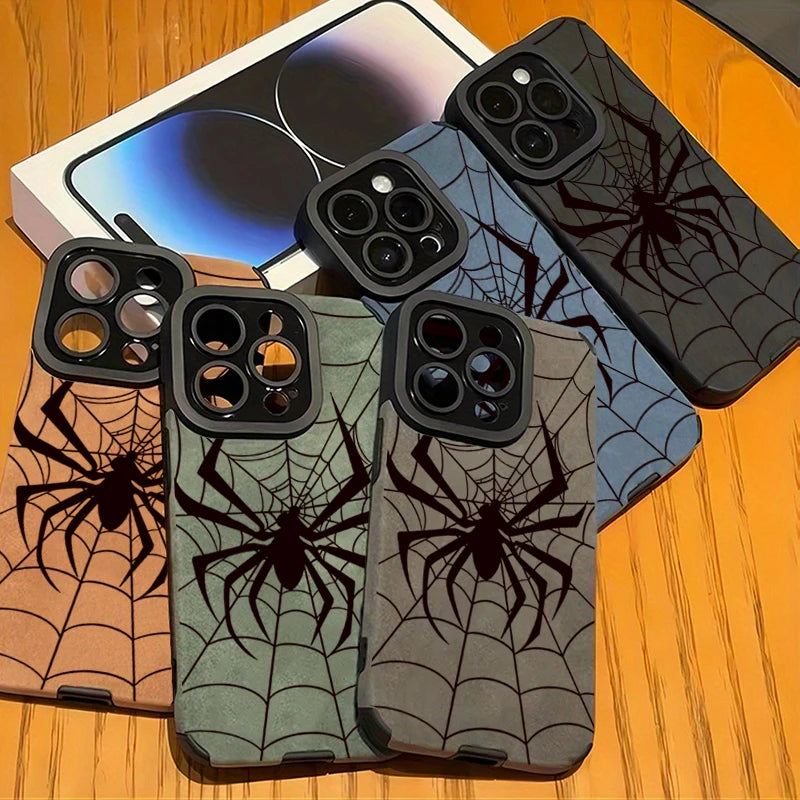 A collection of dark and light gray phone cases featuring a black spider web design displayed on a wooden surface.