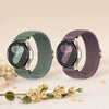 A pair of dark green and purple braided loop watch bands for Garmin devices displayed on a light background.