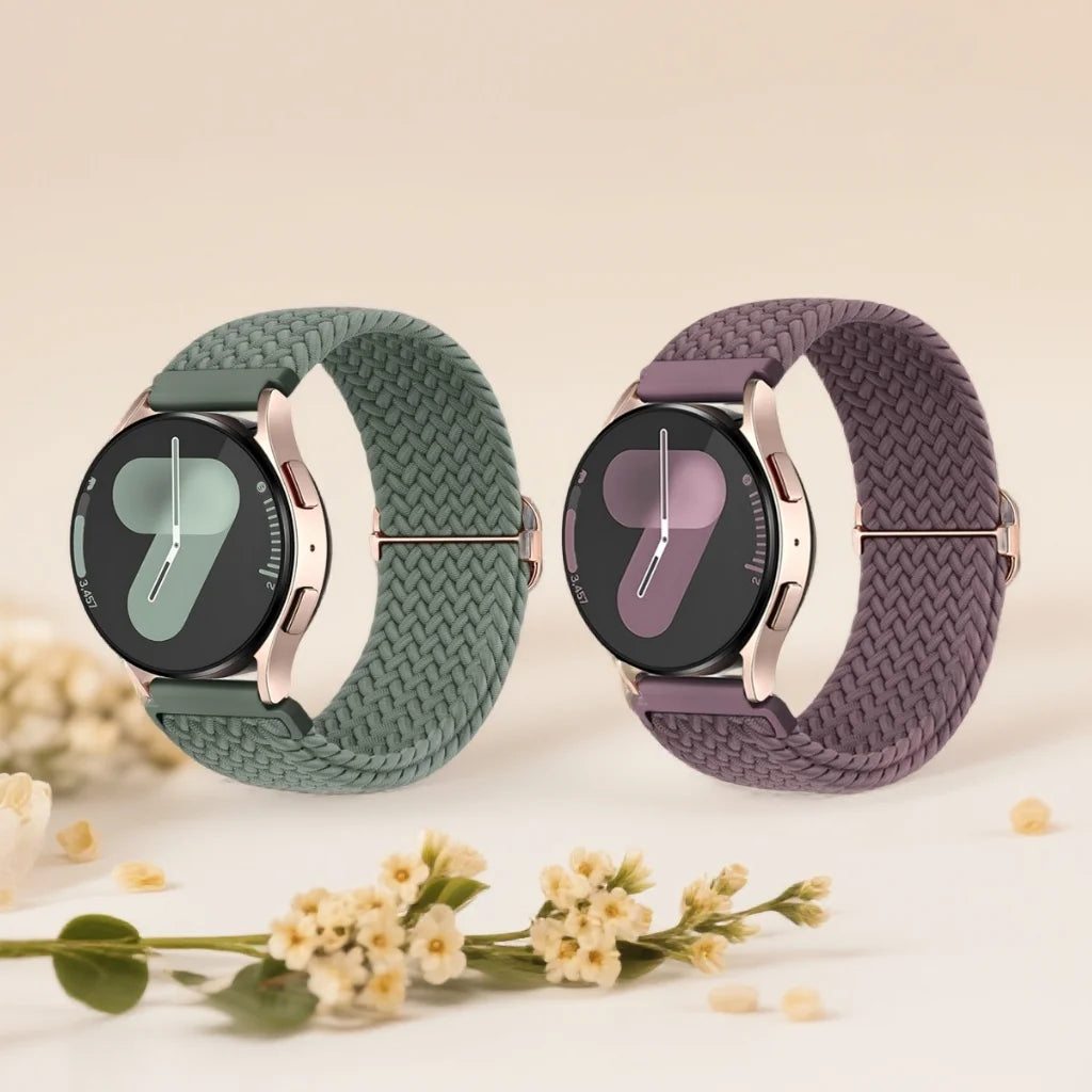 A pair of dark green and purple braided loop watch bands for Garmin devices displayed on a light background.