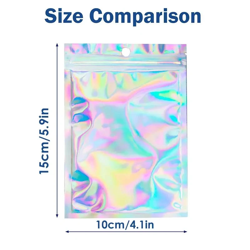 Size comparison showing a holographic resealable mylar bag with a clear front window, measuring 15cm by 10cm.