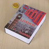 A book cover titled LONDON featuring a red telephone box and a clock tower on a light wooden surface.