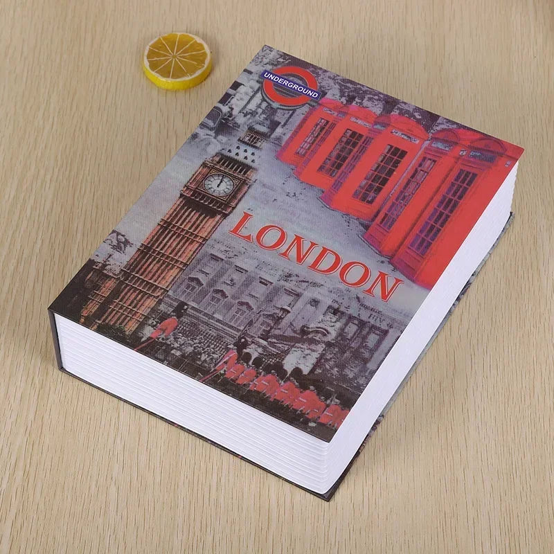A book cover titled LONDON featuring a red telephone box and a clock tower on a light wooden surface.