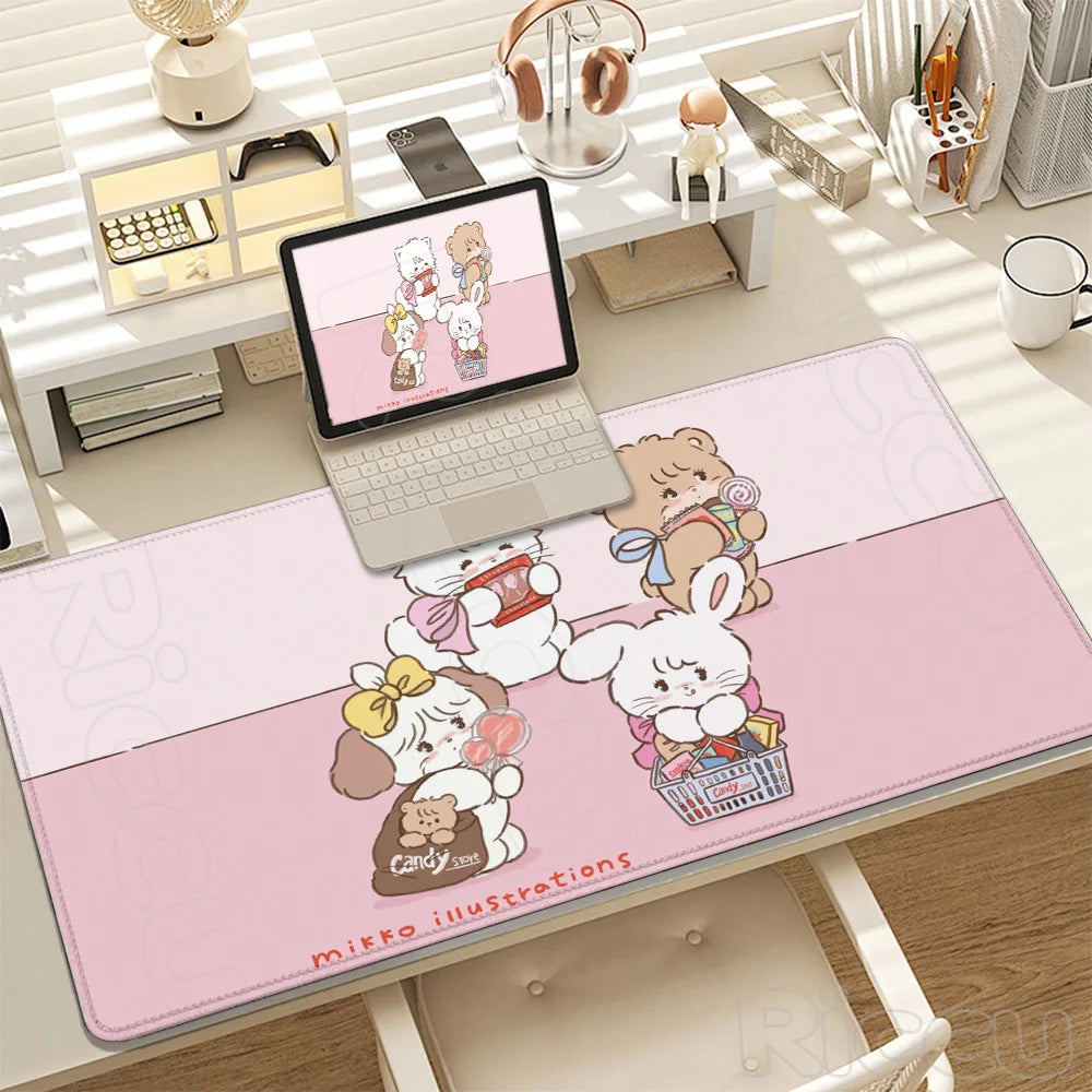 A pink cartoon illustration desk mat featuring cute white bears and a rabbit.