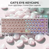 A close-up of pink and white translucent keycaps for a mechanical keyboard, featuring dual-light edges and crystal-clear lege