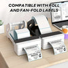 A white and black 2-in-1 thermal label holder is shown with rolls and fan-folded labels on a wooden surface.