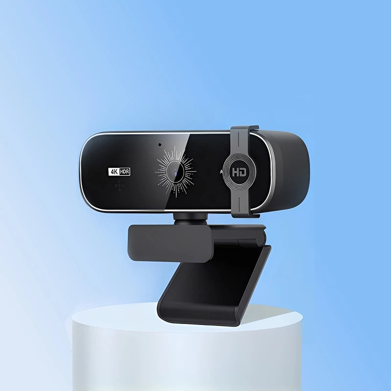 A black 4K auto-focus webcam with a privacy cover and microphone mounted on a white stand.