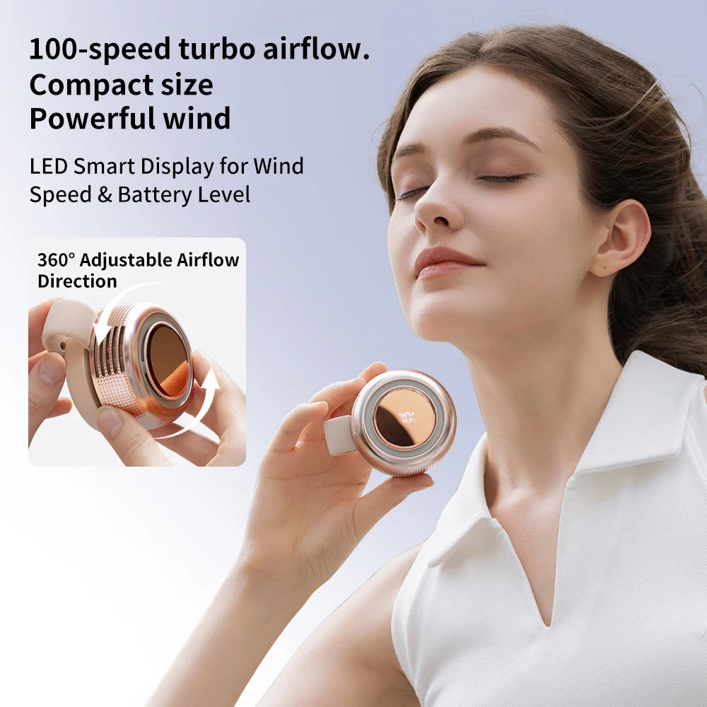 A woman is using a compact, silver clip-on fan with a LED display to generate powerful wind.