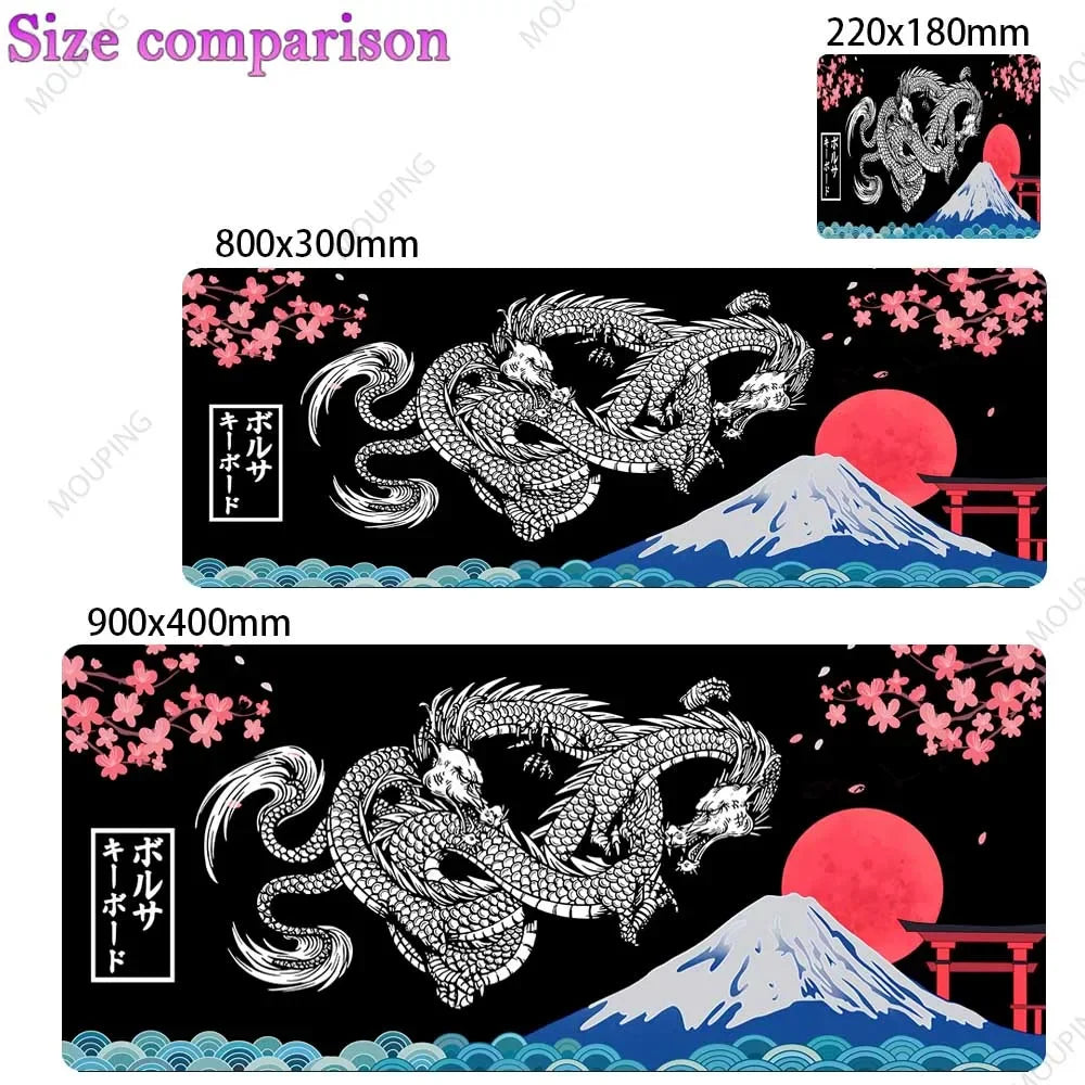 A black gaming desk mat featuring a detailed Japanese dragon and Mount Fuji design with pink cherry blossoms.