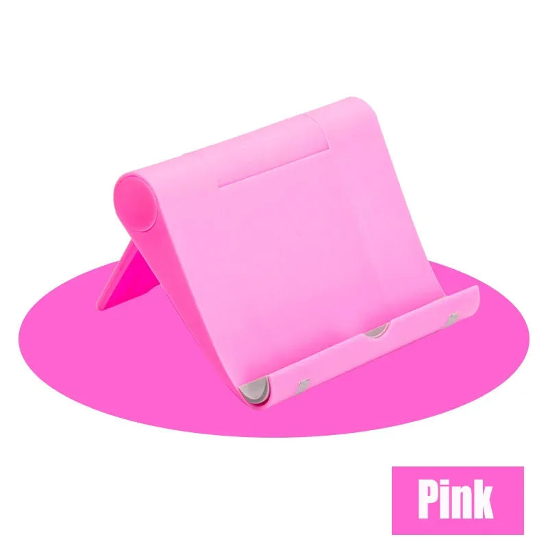 A pink flexible multi-angle tablet and phone desk stand shown from above.