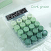 A clear plastic case containing various green buttons and a digital display for a Dopamine Gradient Calculator.