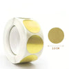 A roll of white kraft paper self-adhesive round labels with gold accents.