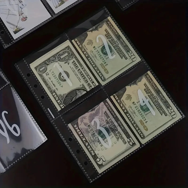 A close-up view of several US dollar bills and envelopes laid out on a dark surface.