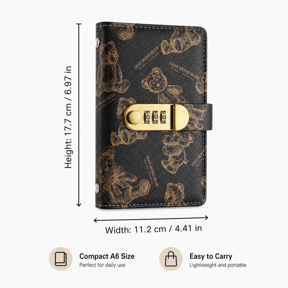 A black leather notebook with a gold clasp featuring a cartoon bear design.