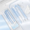 A set of four light blue and white Angelic gel pens with gold accents displayed on a white tray.