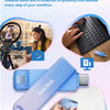 Una unidad flash SanDisk morada junto a una laptop y un smartphone, ilustrando su uso en flujos de trabajo creativos.