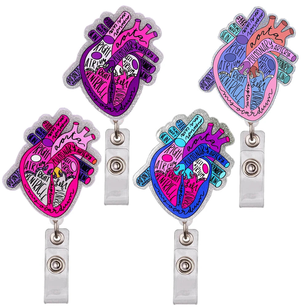 A set of three enamel badge reels featuring colorful anatomical diagrams of the human heart.