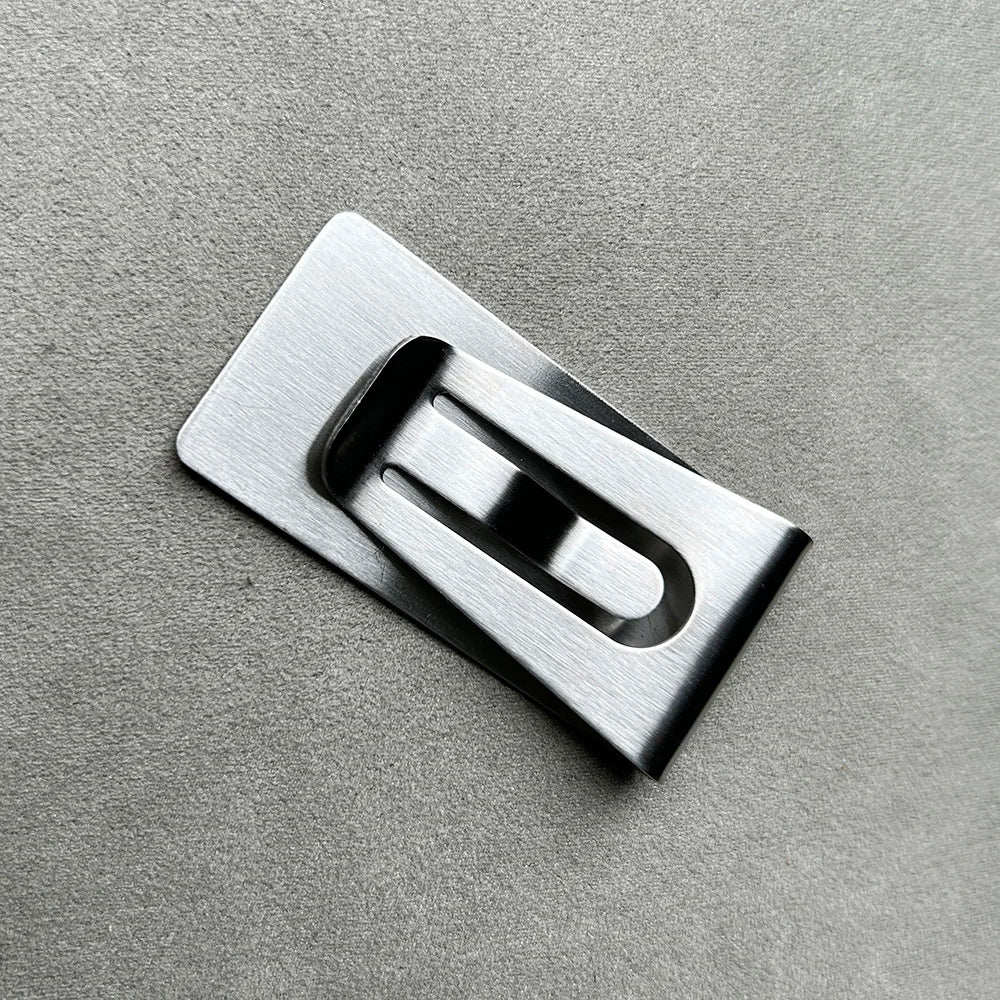 Silver rectangular money clip wallet with a smooth, brushed finish.
