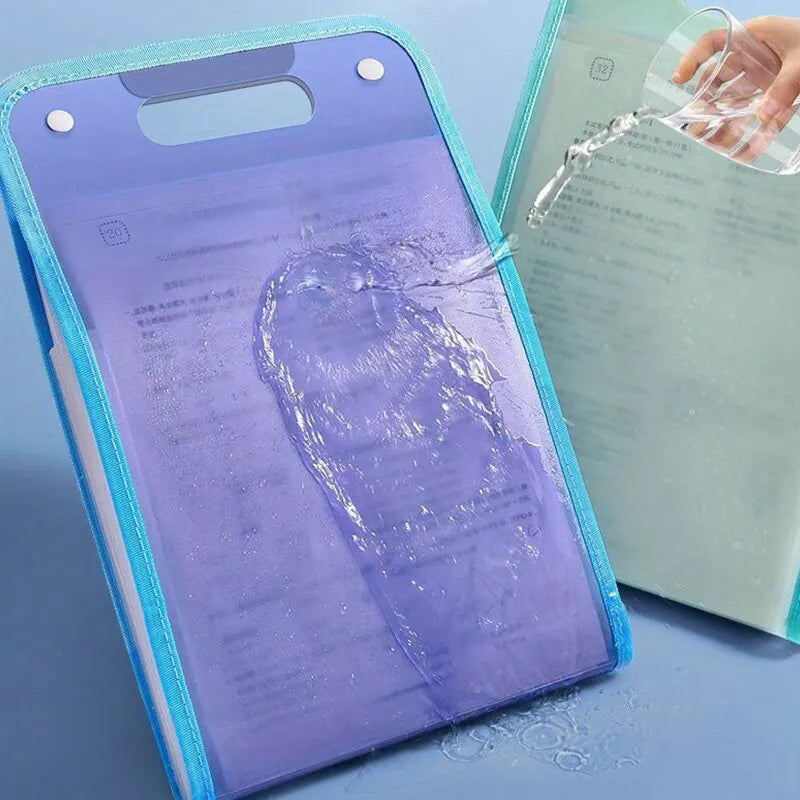 A purple accordion file organizer with a clear plastic sleeve is shown next to a green document.