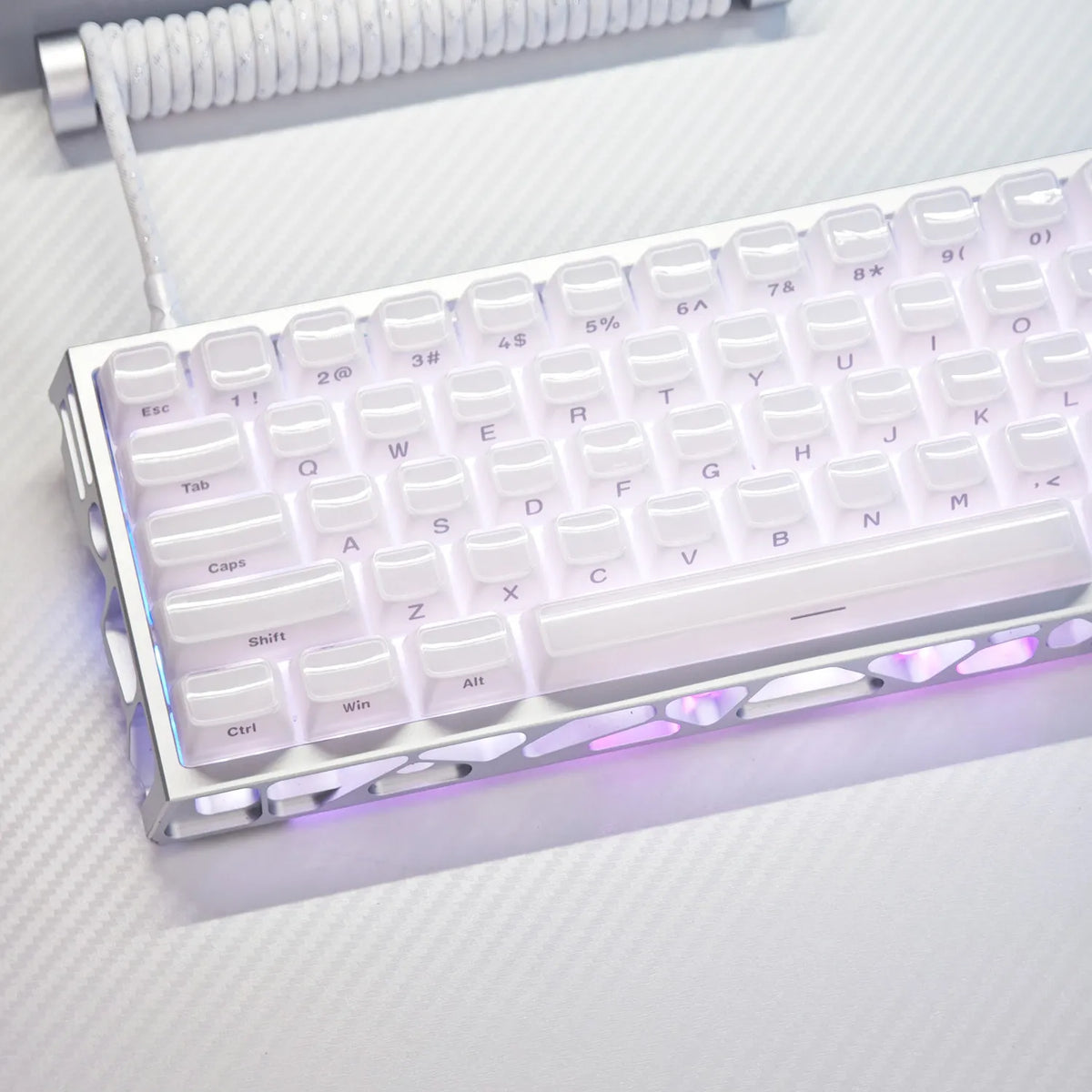 A close-up of a white mechanical keyboard with translucent purple and pink keycaps, illuminated by RGB lighting.
