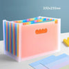 A pink vertical multi-layer storage file rack with colorful plastic strips, shown on a white surface.