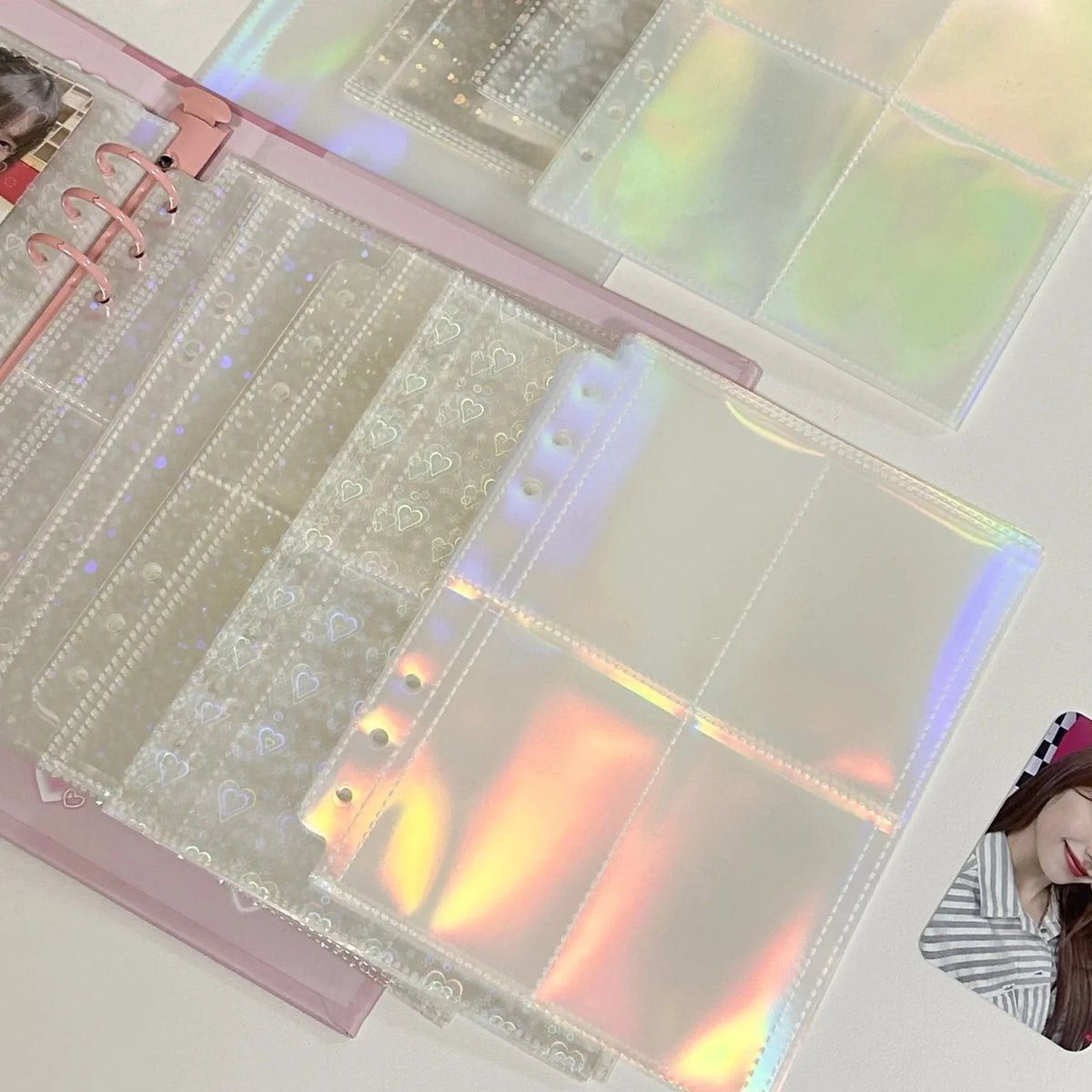 A set of A5 refillable photo sleeves with iridescent and holographic finishes for binder collection.