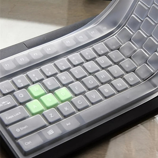A close-up view of a silicone keyboard protector cover for a laptop keyboard, showing various keys and function keys.