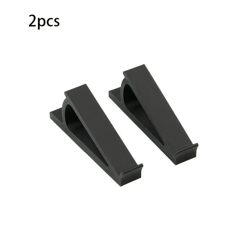 Two black ergonomic keyboard riser stands with anti-slip bases