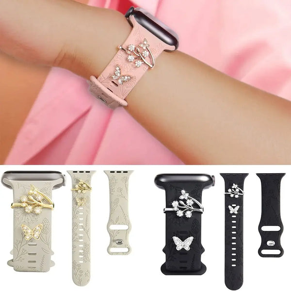 Various decorative metal watch band ornaments and bracelets shown on a wrist.