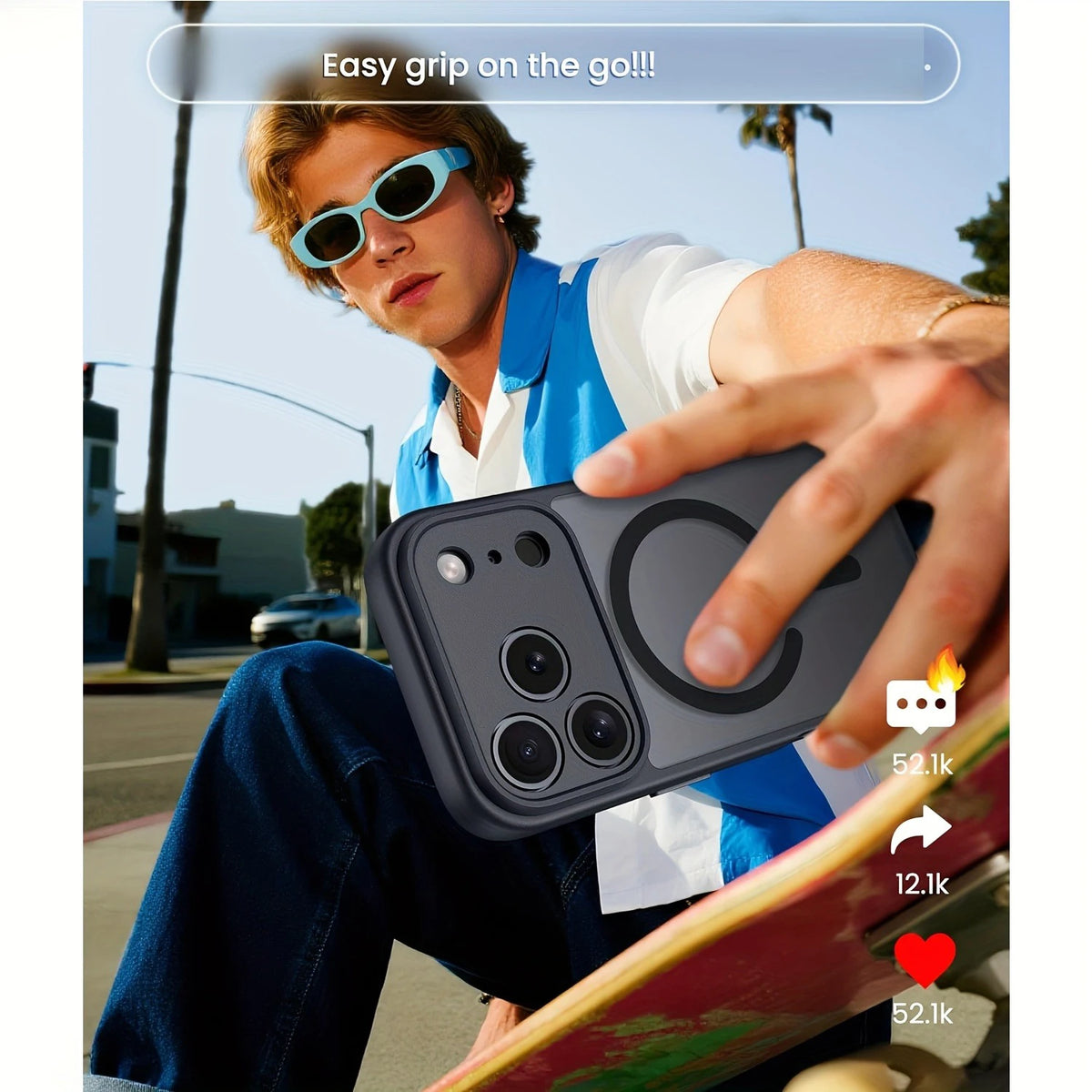 A young man holds a black magnetic wireless charging lens protector case for an iPhone outdoors.
