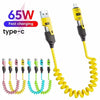 A yellow and black 4-in-1 retractable fast charging cable with a USB-C adapter shown coiled.
