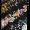 A close-up of decorative PET washi tape patterns featuring colorful lights and foliage on a black background.