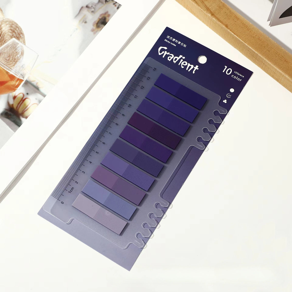 A pack of 10 Gradient clear self-adhesive sticky notes in various shades displayed on a white background.