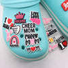 A collection of pink and white die-cut shoe charms featuring words like I Love Mom Cheer Mom and Mama