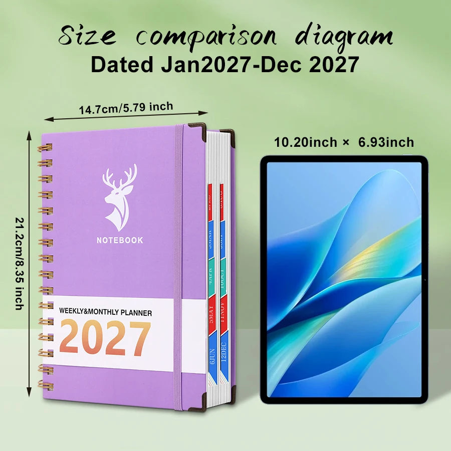 A purple spiral-bound weekly and monthly planner with a deer design next to an iPad.