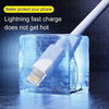 A white USB-C to Lightning fast charging cable is shown plugged into a clear ice cube for cooling.