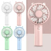 A collection of mini handheld fans in various colors including white, pink, green, and blue.