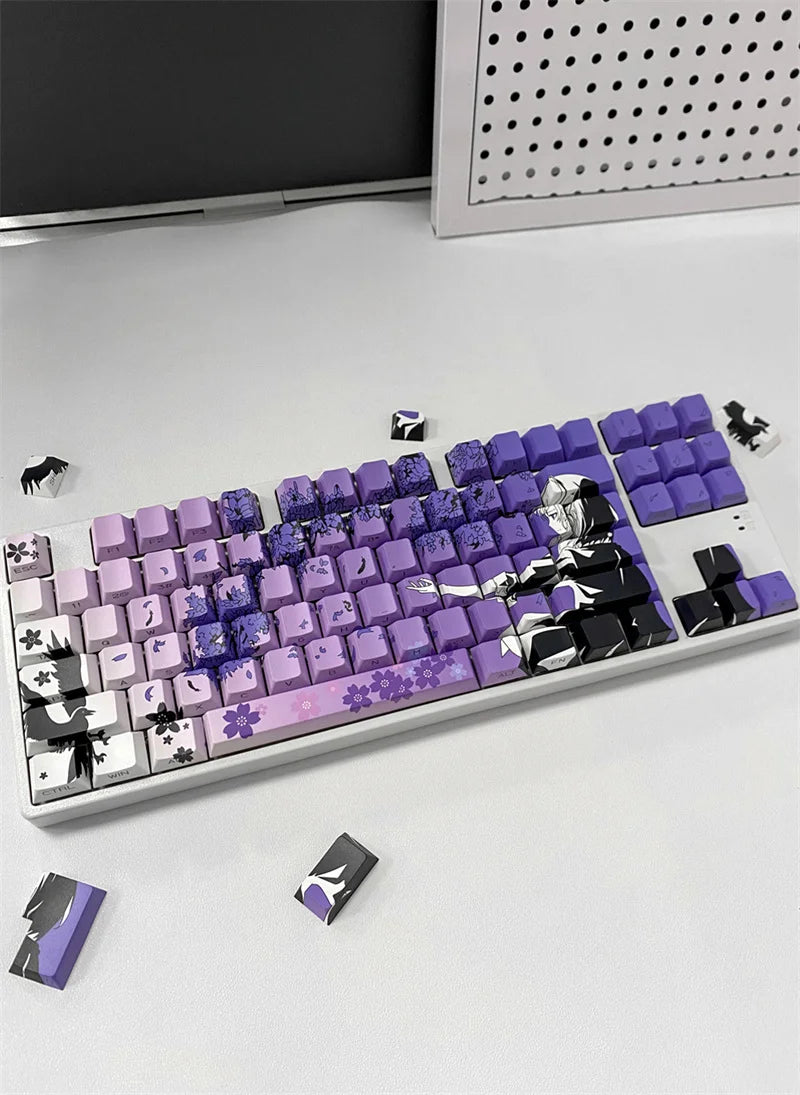 A mechanical keyboard featuring purple and black anime themed PBT keycaps, including character designs.