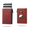 A brown leather wallet with a card pop-up feature and an Apple logo embossed on the cover.
