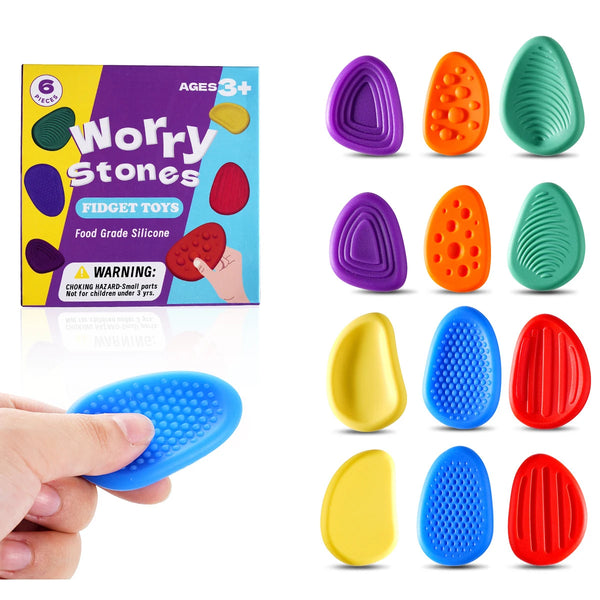 Set bunter Sorgensteine und Fidget-Spielzeug für Kinder, darunter Silikon- und Gummiformen.