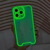 A hand holds a luminous neon green clear phone case for an iPhone, displaying the camera module and body.